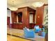 A grand lobby with plush seating, wood paneled columns, decorative lighting, and a reception area at 195 14Th Ne St # 1507, Atlanta, GA 30309