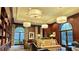 Library lounge featuring floor to ceiling bookshelves, comfortable seating, and arched windows at 195 14Th Ne St # 1507, Atlanta, GA 30309