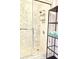 Modern shower boasts eye-catching tile, modern fixtures and convenient shelving for storage at 195 14Th Ne St # 1507, Atlanta, GA 30309