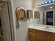 Bathroom features a vanity with a large mirror and jewelry display at 4620 Oak Grove Cir, Cumming, GA 30028