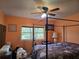 Bedroom features a large bed with floral comforter and large windows at 4620 Oak Grove Cir, Cumming, GA 30028