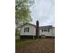 White siding on this house with a red brick chimney at 4620 Oak Grove Cir, Cumming, GA 30028