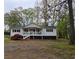 Charming single-story home with a welcoming front porch and meticulously kept landscaping at 4620 Oak Grove Cir, Cumming, GA 30028