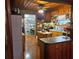 View of the kitchen with wood cabinetry and a large island, with modern appliances at 4620 Oak Grove Cir, Cumming, GA 30028