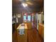 Rustic kitchen featuring wooden cabinetry, brick accents, and butcher block countertops at 4620 Oak Grove Cir, Cumming, GA 30028