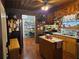 Traditional kitchen with central island, stainless appliances and wood flooring at 4620 Oak Grove Cir, Cumming, GA 30028