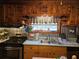 Cozy kitchen boasting stainless steel appliances, decorative shelving, and ample natural light at 4620 Oak Grove Cir, Cumming, GA 30028