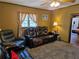 Living area featuring comfortable seating and a view into another room at 4620 Oak Grove Cir, Cumming, GA 30028