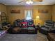 Cozy living room with plush leather seating, wooden decor, and a comforting atmosphere at 4620 Oak Grove Cir, Cumming, GA 30028