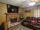 Living room highlighting a brick fireplace with decorative accents and comfortable seating at 4620 Oak Grove Cir, Cumming, GA 30028