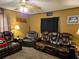 Comfortable living room showcasing a leather sofa and chairs, perfect for relaxation at 4620 Oak Grove Cir, Cumming, GA 30028