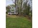 Beautiful large yard with mature trees, and well-manicured lawn at 4620 Oak Grove Cir, Cumming, GA 30028