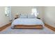Spacious bedroom with a large bed, hardwood floors, and ample natural light at 648 Channing Nw Dr, Atlanta, GA 30318