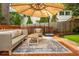 Inviting deck area with comfortable outdoor seating and an umbrella for shade at 648 Channing Nw Dr, Atlanta, GA 30318