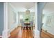 Elegant dining room featuring hardwood floors, a round table with seating for four, and natural light at 648 Channing Nw Dr, Atlanta, GA 30318