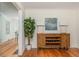 Dining area with hardwood floors, decorative cabinet, and a view into another room at 648 Channing Nw Dr, Atlanta, GA 30318