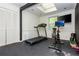 Home gym with a treadmill, exercise bike, rubber flooring, and ample lighting at 648 Channing Nw Dr, Atlanta, GA 30318