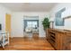Open-concept living room with hardwood floors, leading into a cozy living room with a fireplace at 648 Channing Nw Dr, Atlanta, GA 30318