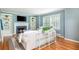 Bright living room with fireplace, built-in bookshelves, hardwood floors, and large window at 648 Channing Nw Dr, Atlanta, GA 30318