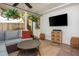 Cozy screened porch featuring comfortable seating, stylish decor, and a ceiling fan at 648 Channing Nw Dr, Atlanta, GA 30318