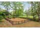 Community playground area features slides, swings, and climbing equipment, perfect for outdoor fun in a beautiful setting at 648 Channing Nw Dr, Atlanta, GA 30318