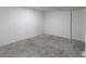 Unfinished basement featuring a concrete floor and white painted walls, ready for customization at 7965 Tower Dr, Douglasville, GA 30134