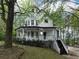 Charming two-story home with a inviting porch and well-manicured lawn at 7965 Tower Dr, Douglasville, GA 30134