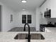 Kitchen view with stainless steel sink, faucet, granite counters and stainless steel appliances at 7965 Tower Dr, Douglasville, GA 30134