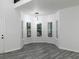 Living room featuring a bay window, gray wood flooring, and white walls at 7965 Tower Dr, Douglasville, GA 30134
