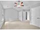Bright bedroom with ceiling fan and two closets at 1797 Brookside Lay Cir, Norcross, GA 30093