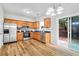 Bright kitchen with stainless steel appliances and sliding glass door to backyard at 1797 Brookside Lay Cir, Norcross, GA 30093