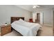 Well-lit bedroom boasts a bed, ceiling fan, and access to an ensuite bathroom at 2968 Greyhawk Ln, Cumming, GA 30040