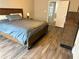 This bedroom offers a spacious interior with hardwood floors and natural light at 2968 Greyhawk Ln, Cumming, GA 30040