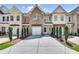 Charming townhouse with a private drive, garage and landscaped front yard at 2968 Greyhawk Ln, Cumming, GA 30040