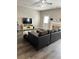 Spacious living room with a fireplace, natural light, and gray wood flooring at 2968 Greyhawk Ln, Cumming, GA 30040