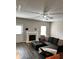 Inviting living room featuring a fireplace and comfortable seating area under a ceiling fan at 2968 Greyhawk Ln, Cumming, GA 30040