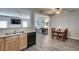 Open living space with hardwood floors featuring combined kitchen, dining area, and living room at 2968 Greyhawk Ln, Cumming, GA 30040
