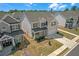 Aerial view of a two-story house featuring a brick and siding exterior, manicured lawn, and a driveway at 70 Clark Lake Ln, Grayson, GA 30017