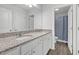 Bathroom featuring granite counters, dual sinks, and a separate toilet and shower area at 70 Clark Lake Ln, Grayson, GA 30017