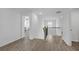 Hallway with wood floors, neutral walls, and a view into other rooms with ample natural light at 70 Clark Lake Ln, Grayson, GA 30017