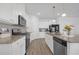 Modern kitchen with granite countertops, stainless steel appliances, and white cabinets at 70 Clark Lake Ln, Grayson, GA 30017
