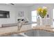 Stainless steel kitchen sink and countertop detail with flowers and modern design at 70 Clark Lake Ln, Grayson, GA 30017