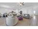 Spacious living area connecting to the kitchen and dining, featuring modern furniture and lighting at 70 Clark Lake Ln, Grayson, GA 30017