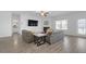 Open living room featuring modern furniture, a fireplace, and plenty of natural light at 70 Clark Lake Ln, Grayson, GA 30017