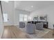 Bright living room with hardwood floors, recessed lights and gray swivel chairs, perfect for relaxing at 70 Clark Lake Ln, Grayson, GA 30017