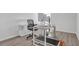 Bright office featuring wood floors, a modern desk and chair, natural light, and exercise equipment at 70 Clark Lake Ln, Grayson, GA 30017