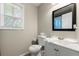 Neutral bathroom featuring a toilet, sink with vanity, mirror, and a window at 1326 Mcpherson Ave., Atlanta, GA 30316