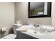Clean and well-maintained bathroom with a vanity, mirror, toilet, and essential toiletries at 1326 Mcpherson Ave., Atlanta, GA 30316