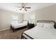 Bright bedroom featuring two twin beds, carpeted floors, a ceiling fan and large windows at 1326 Mcpherson Ave., Atlanta, GA 30316