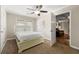 Cozy bedroom features plush carpet, ceiling fan, and view to living area at 1326 Mcpherson Ave., Atlanta, GA 30316